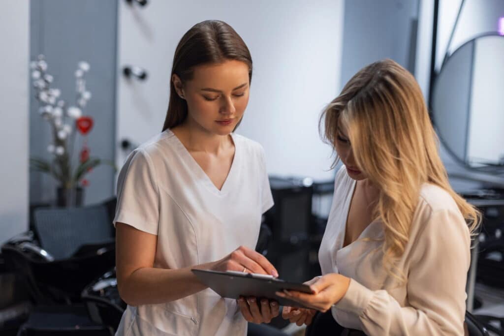 practitioner discussing sculptra vs radiesse
